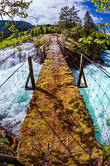 Image showing Suspension bridge over the mountain river, Norway.