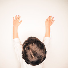 Image showing Closeup of beautiful brown hair on unrecognizable boy, stretchin