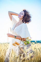 Image showing beautiful smiling woman outdoors in barley field