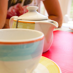 Image showing kettle for making tea and cups in cafe