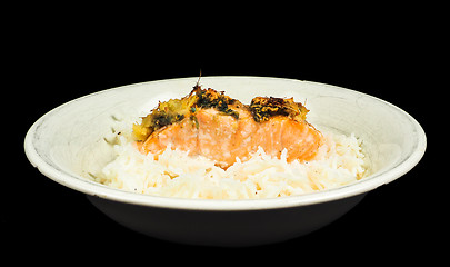 Image showing Delicious piece of salmon on a bed of long grained rice, in a de