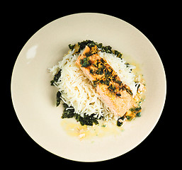 Image showing Delicious piece of salmon on a bed of long grained rice, and spi