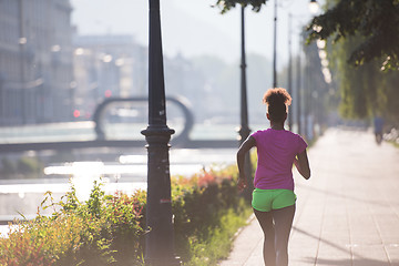 Image showing african american woman jogging in the city