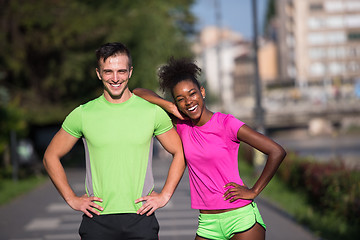 Image showing portrait of young multietnic jogging couple ready to run