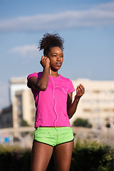 Image showing young african american woman running outdoors