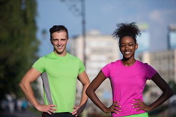 Image showing portrait of young multietnic jogging couple ready to run