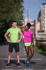 Image showing portrait of young multietnic jogging couple ready to run