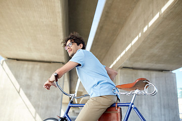 Image showing young hipster man riding fixed gear bike