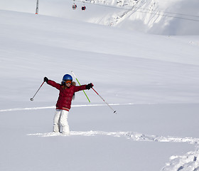 Image showing Happy girl on off-piste slope with new fallen snow at nice winte