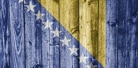 Image showing Flag of Bosnia and Herzegovina on weathered wood