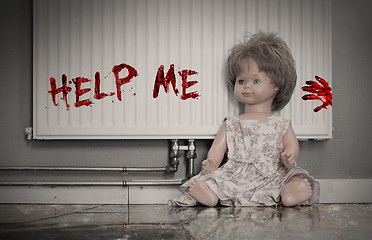 Image showing Concept of child abuse - Bloody doll