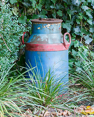 Image showing Old buckets milk, beautifully painted 