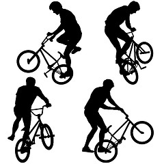 Image showing Set silhouette of a cyclist male performing acrobatic pirouettes. illustration