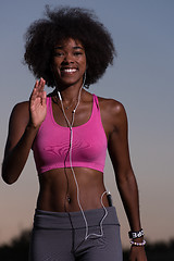 Image showing black woman is doing stretching exercise relaxing and warm up