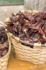 Image showing red hot chilli peppers in a basket