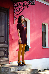 Image showing beautiful white woman in a burgundy dress