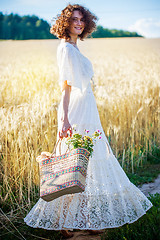 Image showing beautiful smiling woman in white syled dress outdoors