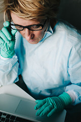 Image showing Front view of scientist working on laptop