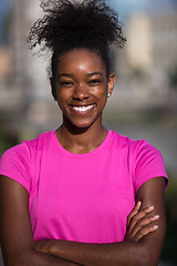 Image showing Portrait of sporty young african american woman running outdoors