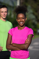 Image showing portrait of young multietnic jogging couple ready to run