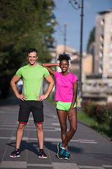 Image showing portrait of young multietnic jogging couple ready to run