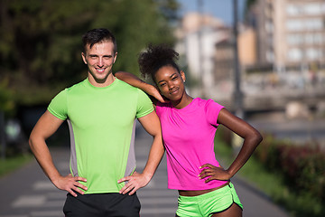 Image showing portrait of young multietnic jogging couple ready to run