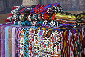 Image showing Scarves and knitted slippers in a street market, Uzbekistan