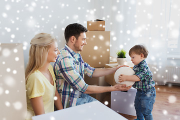 Image showing happy family moving to new home and playing ball