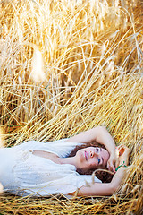 Image showing woman lying in the grass