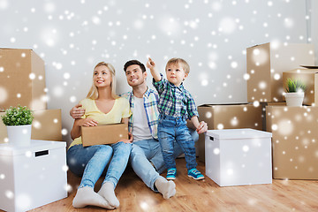 Image showing happy family with boxes moving to new home