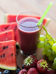 Image showing glass of fruit  juice or smoothie with straw