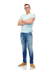 Image showing smiling young man in eyeglasses over white