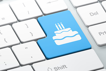 Image showing Holiday concept: Cake on computer keyboard background