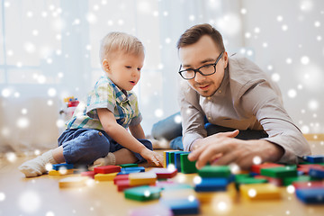 Image showing father and son playing with toy blocks at home