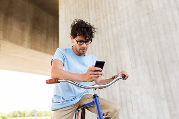 Image showing man with smartphone and fixed gear bike on street