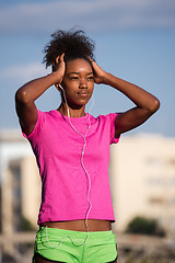 Image showing young african american woman running outdoors