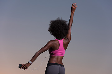 Image showing young black girl dances outdoors