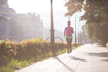 Image showing african american woman jogging in the city