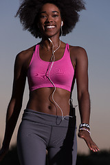 Image showing black woman is doing stretching exercise relaxing and warm up