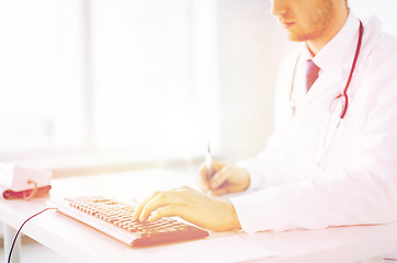 Image showing male doctor typing  on the keyboard