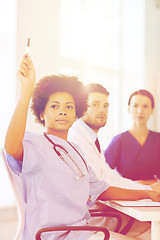 Image showing group of happy doctors on conference at hospital