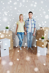 Image showing smiling couple with big boxes moving to new home