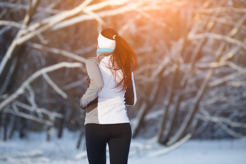 Image showing Sport girl in winter forest