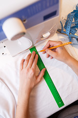 Image showing Seamstress makes pattern top view