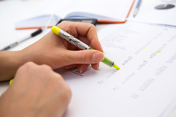 Image showing Girl works with paperwork, reports