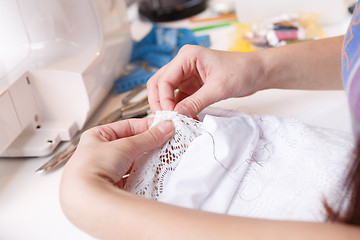 Image showing Girl works with white cloth