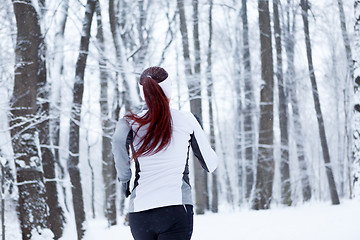 Image showing Young brunette in winter park
