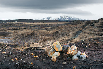 Image showing Icelandic landscape with rocks on a field