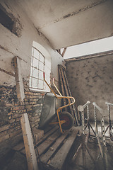 Image showing Wheelbarrow in a warn barn