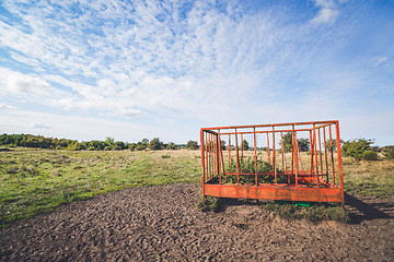 Image showing Rural landscape with a cage on a field